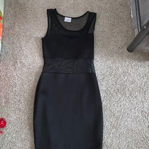 Small black dress- fitted with sheer shoulder and waist